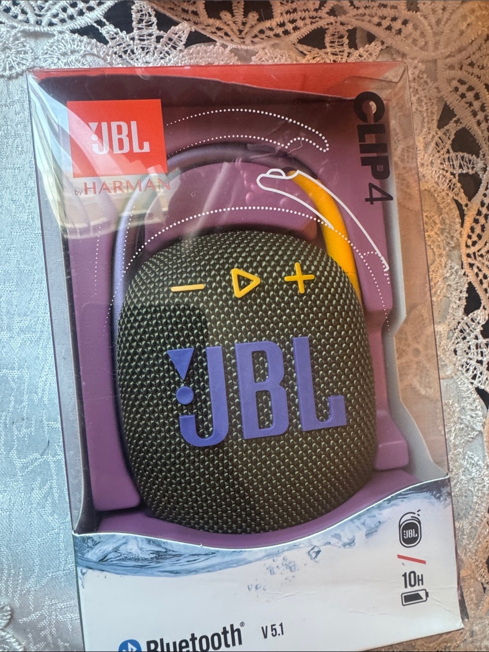 JBL Clip 4 Portable Bluetooth Speaker in Black with Purple and Yellow Accents